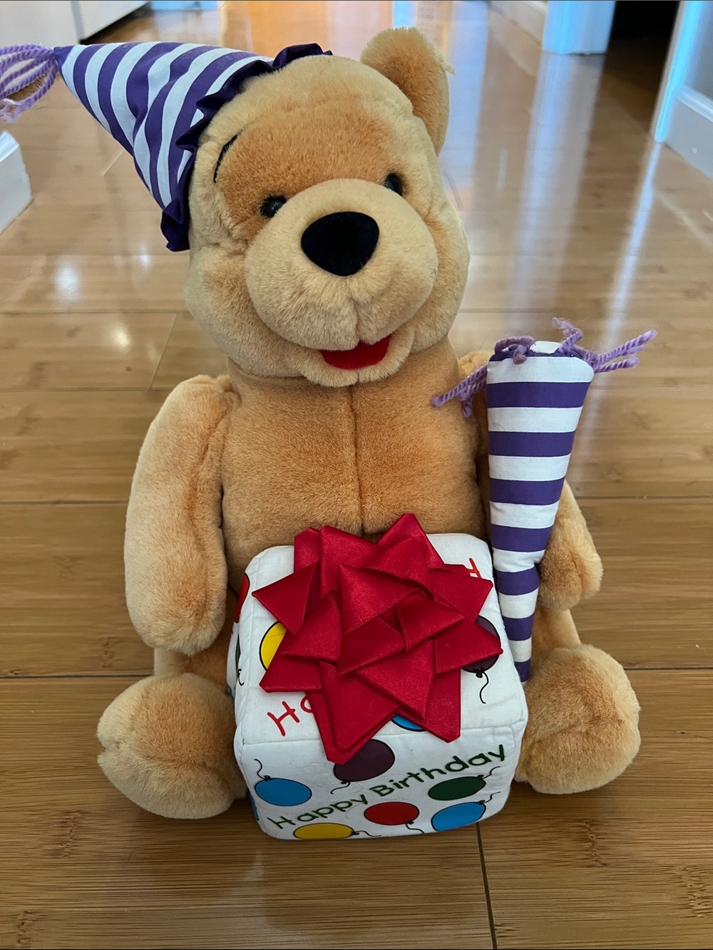 Disney Tan Plush Bear with Purple Stripe Party Hat and Red Bow Gift